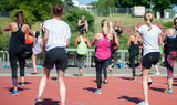 A group of women working out in secondhand workout pants from online consignment store BinxBerryConsignment.com