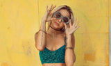 A woman modeling a shirt similar to one that could be found at the best secondhand online thrift shop, BinxBerryConsignment.com
