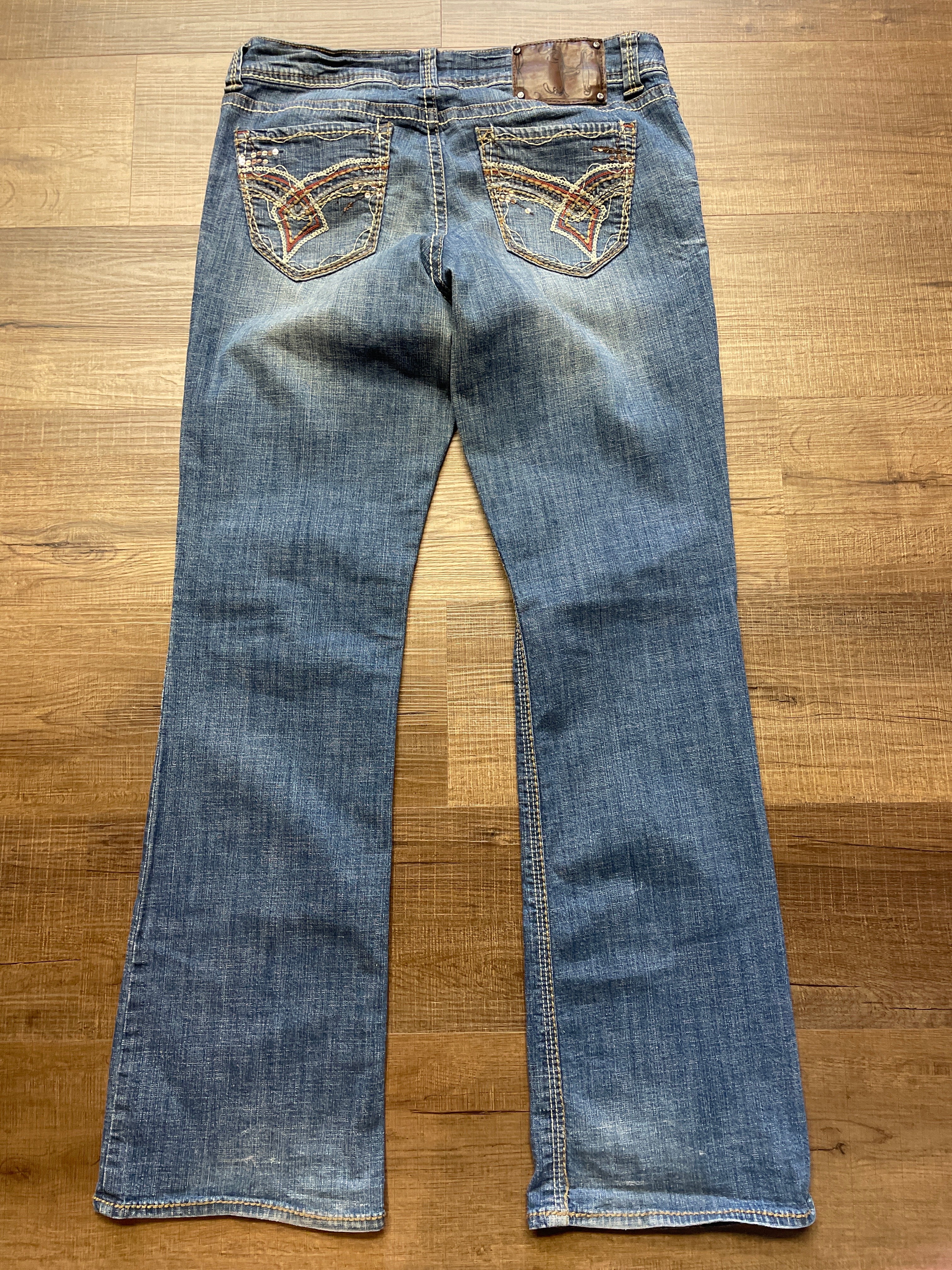 Hydraulic Low-Rise Mid-Wash Jeans (11/12)