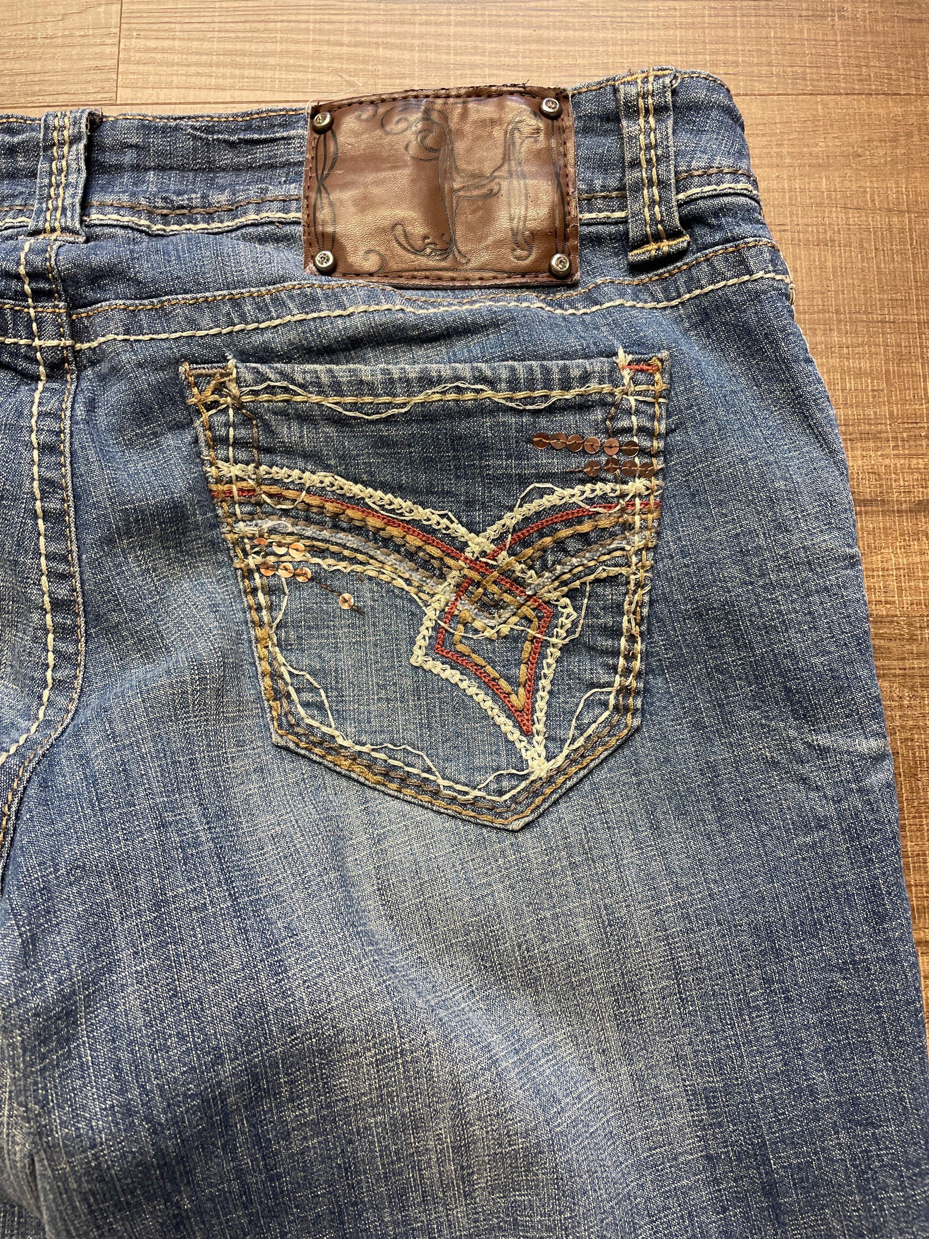 Hydraulic Low-Rise Mid-Wash Jeans (11/12)