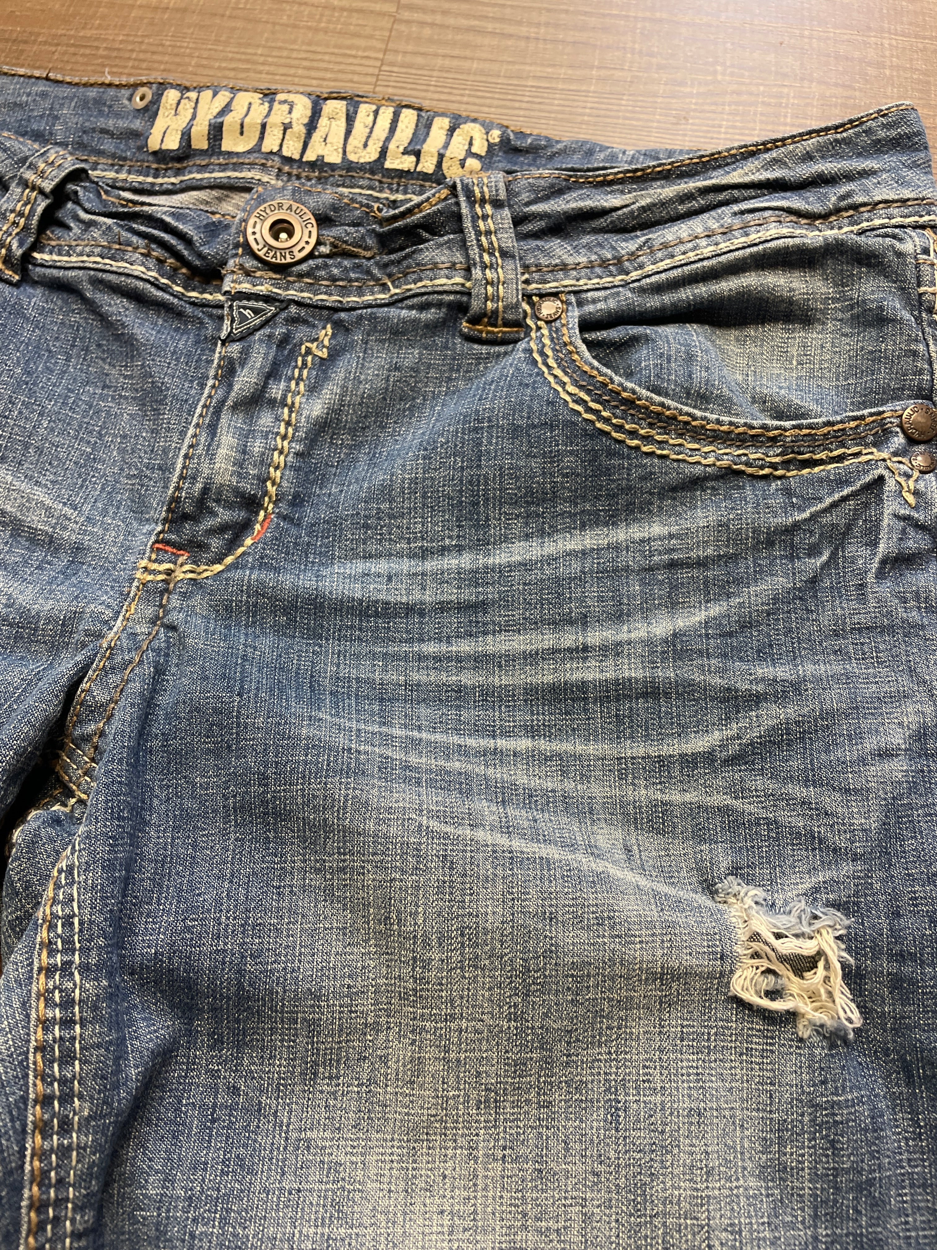 Hydraulic Low-Rise Mid-Wash Jeans (11/12)