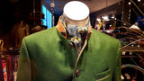 A mannequin dressed in a green blazer and neck scarf as the header of a blog post for BinxBerry Consignment, the best online consignment shop