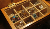 A vintage jewelry box filled with unique second hand jewelry available at online thrift store BinxBerry Consignment