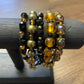 Gold & Black Beaded Bracelet with Black Emblem